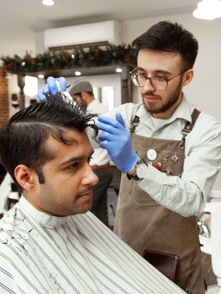 A man having a scissor cut at the studio